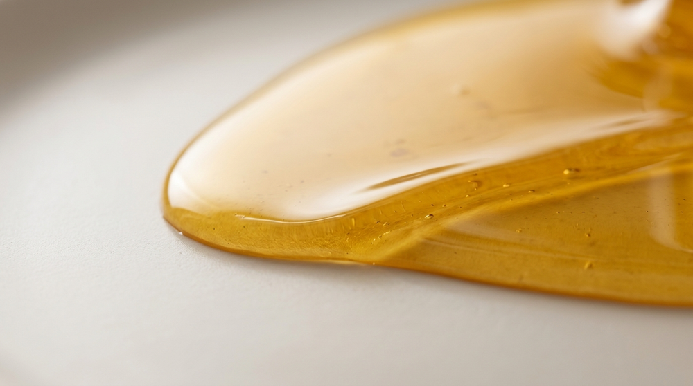 Macro photograph of a viscous liquid coating a surface